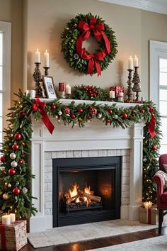 a fireplace decorated for christmas with wreaths and candles