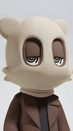 a cartoon bear with big eyes and a suit on it's head, standing in front of a white background