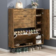 This elegant shoe storage cabinet is designed to seamlessly blend into your home decor while providing ample space for your footwear collection. With the capacity to store 16 pairs of shoes, it features a self-contained design that keeps your shoes organized and out of sight. The innovative flip drawers with two entrances allow for easy access from either side, while the 3-layer entrance shoe rack ensures that your shoes are neatly tucked away. Crafted from solid wood, this cabinet is not only durable but also adds a touch of sophistication to your entrance area. Cabinet Behind Door, Door Entrance Decor, Shoe Rack Door, Dressing Ikea, Entryway Narrow, Shoe Rack Cabinet, Contemporary Color Schemes, Narrow Shoe Rack