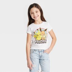 Your young trainer will be able to catch 'em all in this Pokemon Eevee & Pikachu Short-Sleeve Graphic T-Shirt. This pullover T-shirt has a front illustration of Pikachu and Eevee against a bullseye background above the bold "Pokemon" name for a fun look that celebrates anime fandom in style. Featuring a classic crewneck, short sleeves and a standard fit that hits below the waist, this tagless tee in a versatile white shade is made of pure cotton to keep them comfy whether they're at home or out Pokemon Eevee, Embroidered Shorts, Teenager Outfits, Girls Long Sleeve, Girls Shopping, Girls Tshirts, Graphic Shirts, Sleeve Styles, Pure Cotton