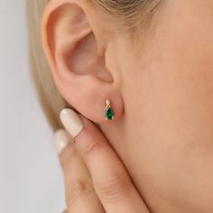 Dazzle and delight with a touch of timeless elegance with our handcrafted 14K solid gold drop earring, featuring a lustrous real diamond and a captivating emerald gemstone, the birthstone of May. Each earring is meticulously crafted to highlight the verdant allure of the emerald, paired with the sparkle of a solitaire diamond that cascades with light with every turn of your head. Perfect for celebrating birthdays, anniversaries, or simply elevating your everyday style. Constructed with the utmos Real Diamond Earrings, Stud Design, Diamond Earring, May Birthstone, Christmas Gift For Her, Solitaire Diamond, Diamond Drops