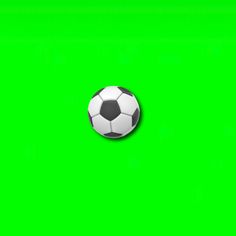 a soccer ball sitting on top of a green screen