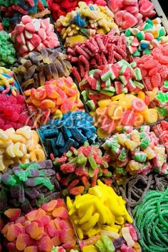 many different colored candies are on display