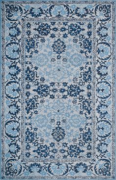 a blue and white rug with an intricate design