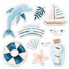 some watercolor stickers that are on top of each other, including a dolphin