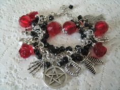 "This beautiful bracelet has red faceted beads, red glass rose beads, black czech glass beads, silver foil beads, sterling silver plated bead caps, pewter silver pentacle and pewter silver charms . 7\" long can be adjusted to 9\". Lobster clasp." Dragons Breath Fire Opal, Wicca Jewelry, Goddess Bracelet, Rose Beads, Gothic Bracelet, Vampire Halloween, Glass Rose, Halloween Gothic, Goddess Jewelry