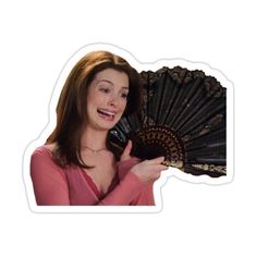 a woman holding a fan in her hand