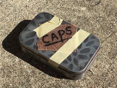 a piece of luggage sitting on the ground with a tag that says gap written on it