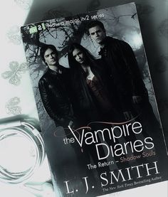 the vampire diaries book is laying on top of a table