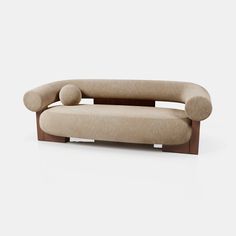 a couch with two pillows on it and a wooden frame around the armrests