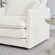 a white chair sitting on top of a hard wood floor next to a coffee table