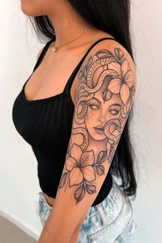 a woman with a tattoo on her arm