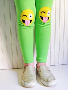 {DESCRIPTION} These fun and functional knee patch leggings are not only adorable, but they are made to last. Made with bright apple-green, medium-weight cotton lycra, these leggings are reinforced at the knees with yellow, crazy face emojis to protect your kiddo's delicate knees from playground wear and tear. Please note these leggings are handmade and some slight variation may occur. Leggings have an elastic non-roll waist band for a comfortable fit. Perfect for your emoji-obsessed kiddo! Meets Playful Elastic Bottoms For Spring, Playful Bottoms For School In Spring, Fun Cotton Bottoms For School, Cute Cotton Leggings For Spring, Fun Green Stretch Bottoms, Cute Green Cotton Bottoms, Playful Fitted Bottoms For School, Cute Stretch Pants For Spring, Stretch Cotton Fun Bottoms