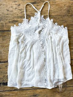 Upgrade your summer wardrobe with this delicate White Lace Trim Cami. Crafted from soft and airy fabric, this top features a beautiful lace trim, adding a touch of sophistication and femininity. Dress it up or dress it down and look effortlessly chic in any occasion. ** Only 1 ** + Size Small + Runs true to size. This is a loose flowy top Lace Trim Cami, Flowy Top, Flowy Tops, Clothing Co, Only 1, Summer Wardrobe, White Lace, Trendy Fashion, Lace Trim