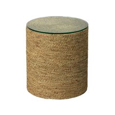 a round glass and jute stool on a white background