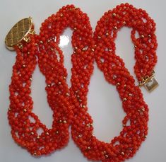 ANTIQUE QUALITY 14K ITALIAN UNDYED SARDINIA RED CORAL LARGE NECKLACE Beautiful ANTIQUE necklace of red Mediterranean coral MADE IN ITALY and 2.5 MM 14K beads with large Fancy push clasp The LARGE clasp is marked 14k on ONE END. WOVEN WITH 3MM 14K GOLD BALLS THROUGHOUT THE NECKLACE. I have polished the clasp / WONDERFUL CONDITION. The necklace has 5 strands of 2.75-3 MM RARE TOMATO RED CORAL beads that are twisted. A pretty gentle fall around the neck line. It is choker length; 17 inches. Please Luxury Red Coral Necklaces, Luxury Red Coral Necklace, Elegant Yellow Gold Jewelry With Red Coral, Elegant Red Coral Necklace For Formal Occasions, Elegant Red Coral Necklace For Formal Events, Formal Yellow Gold Jewelry With Red Coral, Luxury Red Coral Jewelry For Formal Occasions, Luxury Red Coral Jewelry, Elegant Red Coral Gemstone Necklace