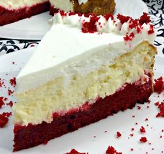 a slice of red velvet cake with white frosting