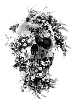 a black and white photo of a skull with flowers