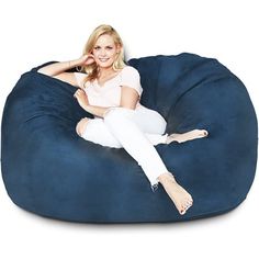 a woman sitting on a bean bag chair