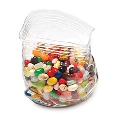 a glass container filled with lots of colorful candy