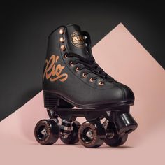 a pair of roller skates sitting on top of a pink and black background