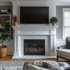 a living room with a fireplace and tv above it