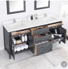 a bathroom vanity with two sinks and drawers