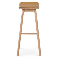 a wooden stool with a tan leather seat on the top and bottom, against a white background