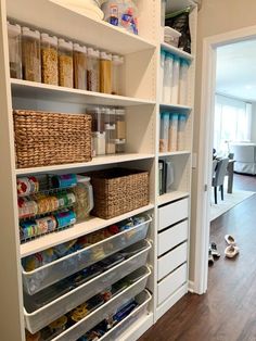 an organized pantry with baskets and food items