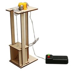 an electronic device is attached to a wooden stand