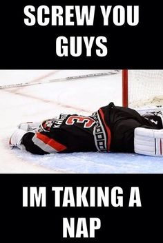 a hockey goalie laying on the ice with his arms out in front of him that says screw you guys i'm taking a nap