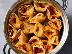 an overhead view of some pasta shells in a pot