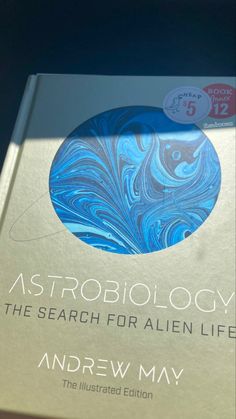 the book astrobiology is sitting on a table