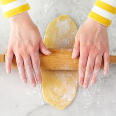 a magazine cover with hands rolling dough on it