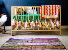 a baby's crib and rocking chair in a child's room