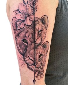 two lions with flowers on their heads are shown in this tattoo design by artist mark