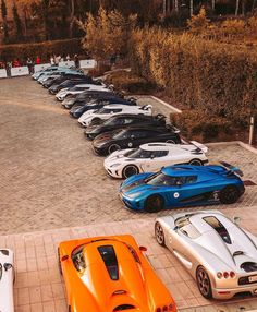 a row of sports cars parked next to each other