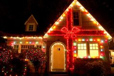 a house covered in christmas lights and decorations