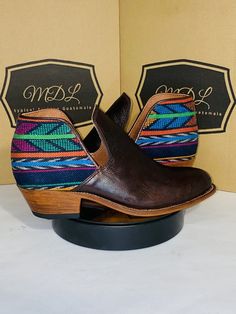 Booties handmade 100% leather design of huipil indigenous of Guatemala Color: Brown Size: 9 If you want to see more products and more styles you can visit our website www.mdltypicalfashion.com leather sole and rubber heel heel height 2″  Thick heel Almond tip Side v cut Clasp poke Bohemian Leather Slip-on Boots, Traditional Leather Slip-on Boots, Brown Slip-on Festival Boots, Handmade Western Boots, Handmade Bohemian Leather Boots, Traditional Multicolor Leather Boots, Women Shoes Fashion, Womens Booties, Booties Ankle Boots