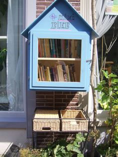 there is a blue book case with books in it