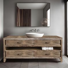 a bathroom with a sink, mirror and wooden cabinet in front of the door to another room