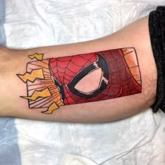 a man with a spiderman tattoo on his arm