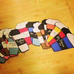 a pile of colorful socks sitting on top of a wooden floor