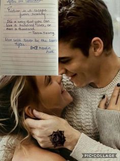 a young man and woman cuddling in front of a piece of paper with writing on it