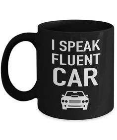 a black coffee mug that says i speak fluent car