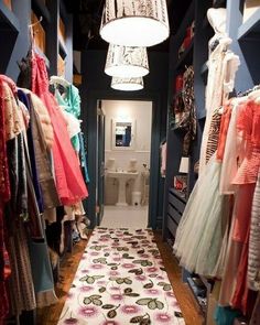 the closet is full of clothes and dresses