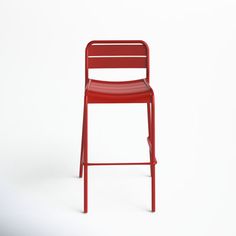 a red metal bar stool against a white background with the seat up and back down