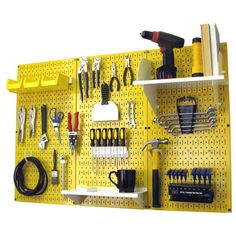 a yellow pegboard with tools hanging on it