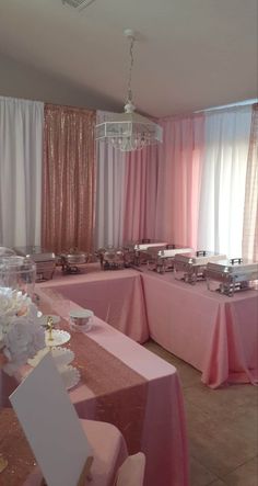 the tables are covered with pink linens