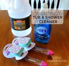 some cleaning supplies are sitting on a table with the words super simple tub and shower cleaner